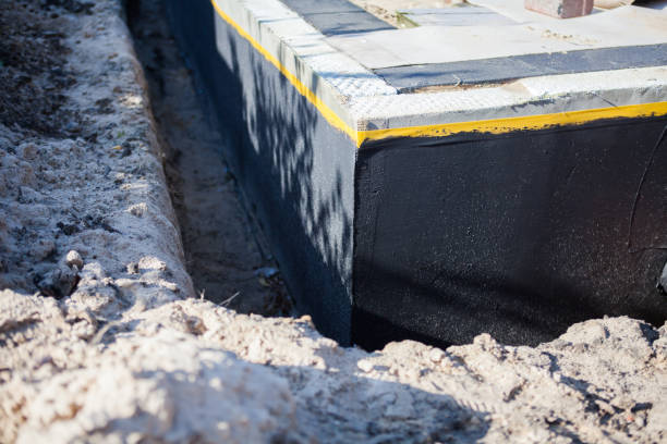 Professional Basement Waterproofing technician working in Huntington Station, NY